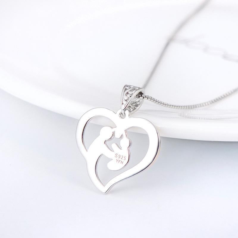 Mother holding child necklace clearance