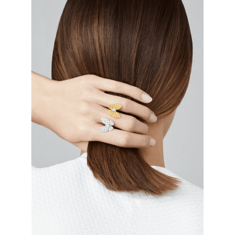 Two butterfly between the finger ring top